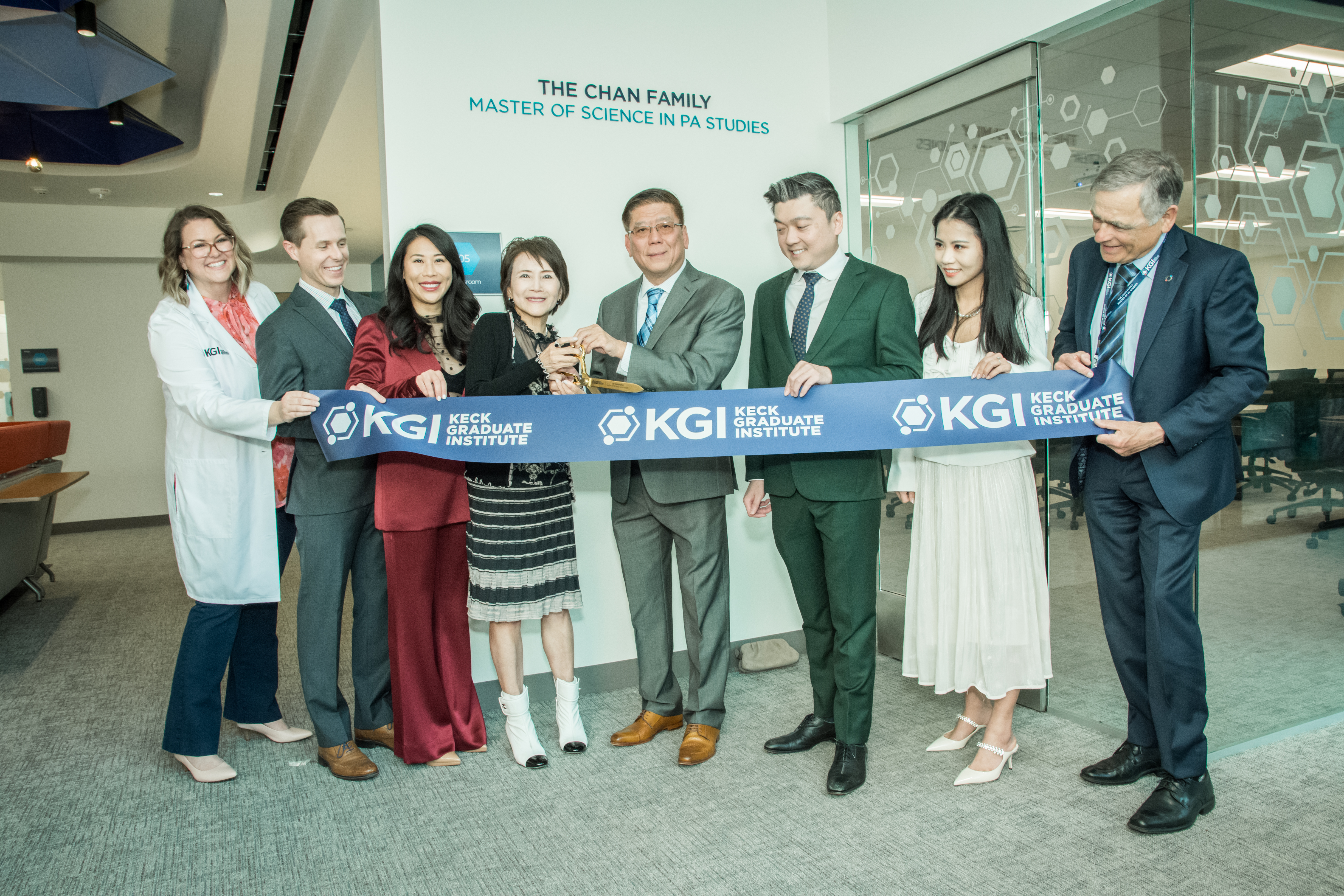 The Chan Family and leaders from KGI cut the ribbon to celebrate KGI's new Chan Family MSPA Studies program.