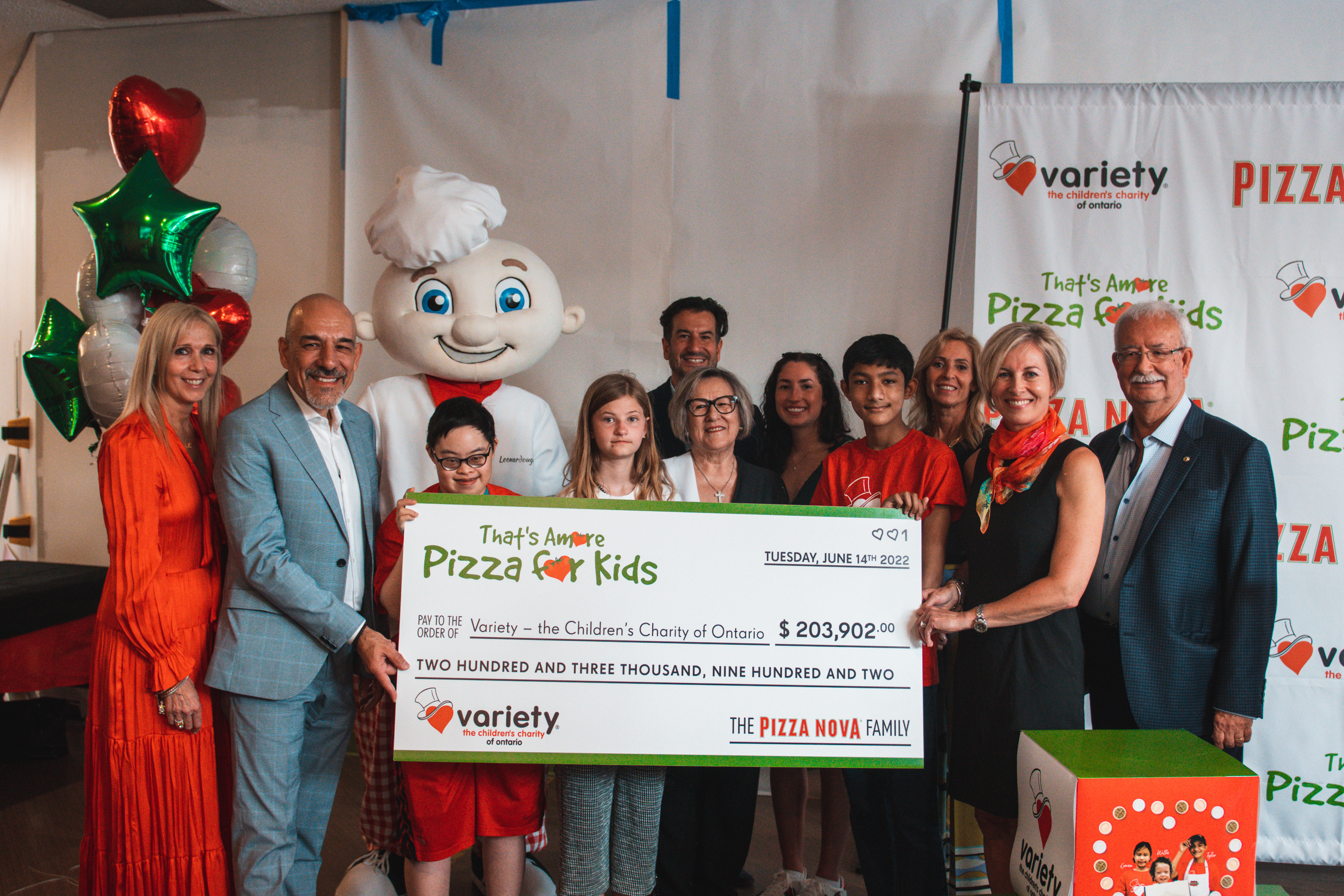 Domenic Primucci, president of Pizza Nova and Sam Primucci, founder, present a cheque for more than $200,000 to Karen Stintz, CEO of Variety - The Children’s Charity of Ontario.