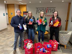 Avenues for Youth picks up personal care items from the TopLine Marketing team