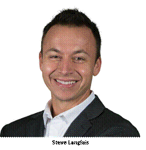 A person wearing a suit and tie smiling at the camera  Description automatically generated