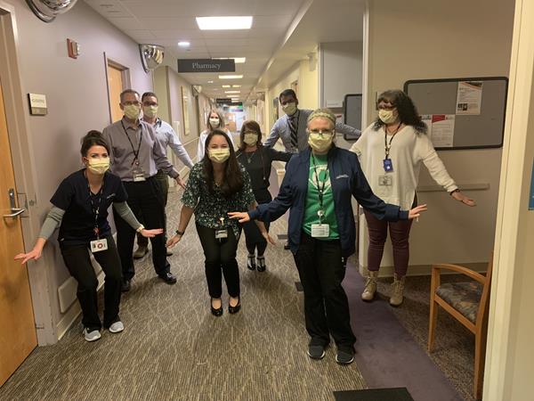 Dr. Ross Camidge, a thoracic oncologist at the University of Colorado Cancer Center (second from the left) and members of the team at UCHealth University of Colorado Hospital during the Covid-19 pandemic.