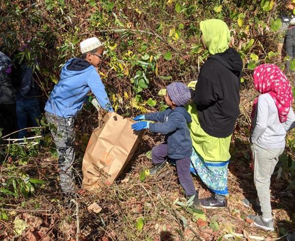 Volunteers from the Dawoodi Bohra community of San Francisco regularly remove trash and invasive plants from Alameda Creek.