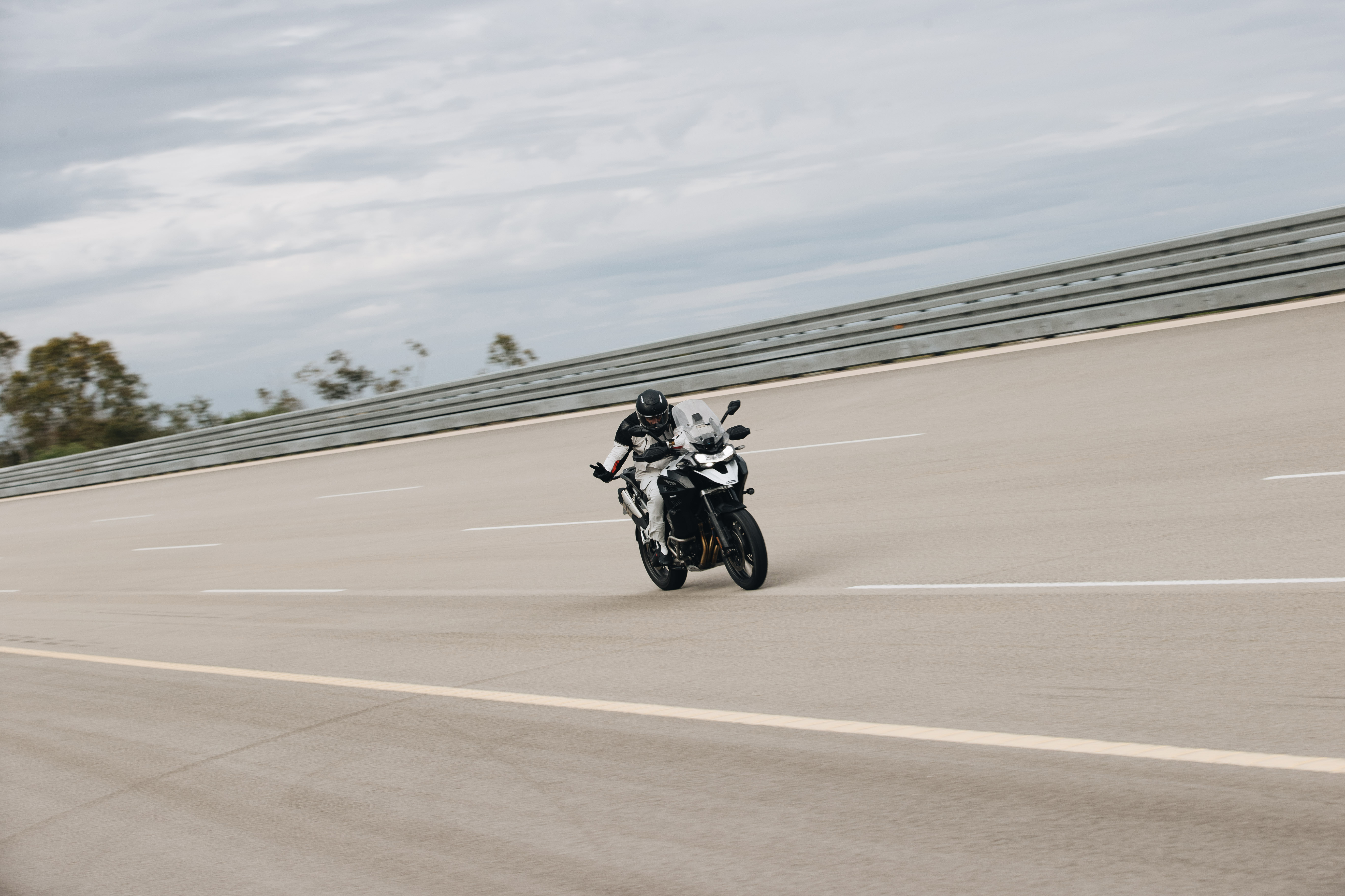 Iván Cervantes riding a Triumph Tiger 1200 GT Explorer at the Nardò Technical Center in Italy