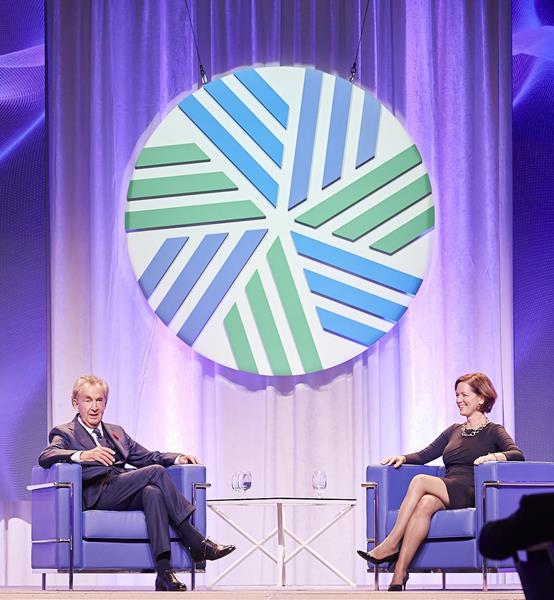 Gerald W. Schwartz on stage with Margaret Franklin, CFA for a candid and interactive fireside chat