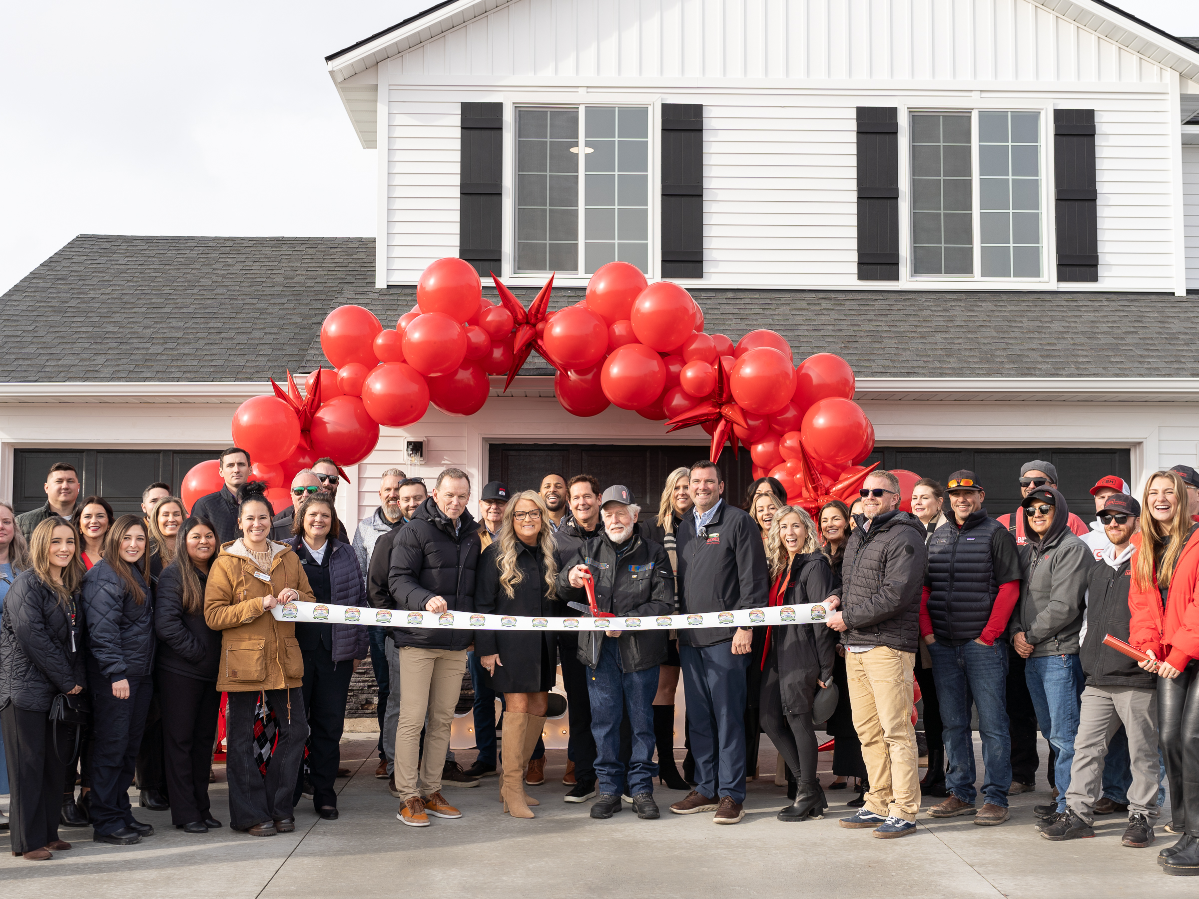 CBH Homes held a ribbon cutting for their latest community in Caldwell, Idaho featuring the Caldwell Chamber of Commerce, the Mayor of Caldwell, and very special guests, the Guches Family.