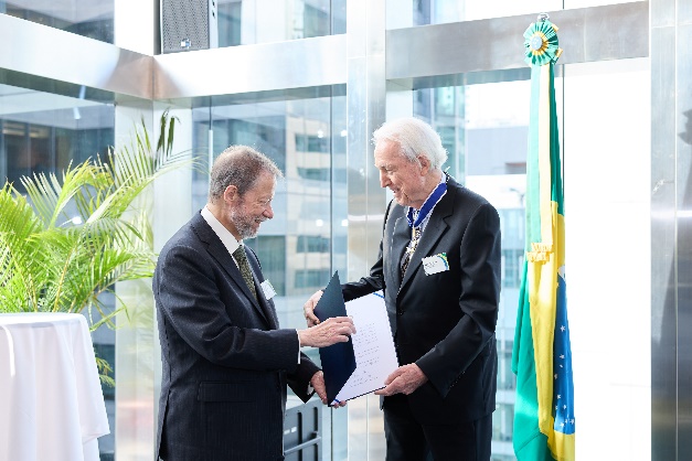 Ambassador Manuel Innocencio de Lacerda Santos Jr (right), conferring the insignia of Commander of the Order of Rio Branco on Mr Klaus Heymann (left)