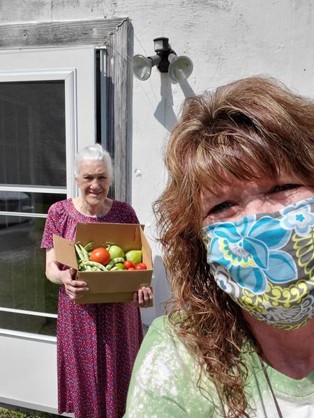Renee Thomas had a porch visit with Bea and delivered food from the Grateful Bread Food Pantry and from her own home garden.