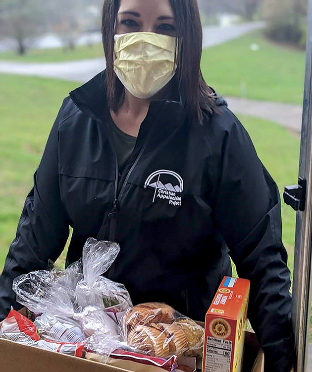 Hannah Burdette, a caseworker with Christian Appalachian Project's Elderly Services Program, delivers food to seniors in Eastern Kentucky.