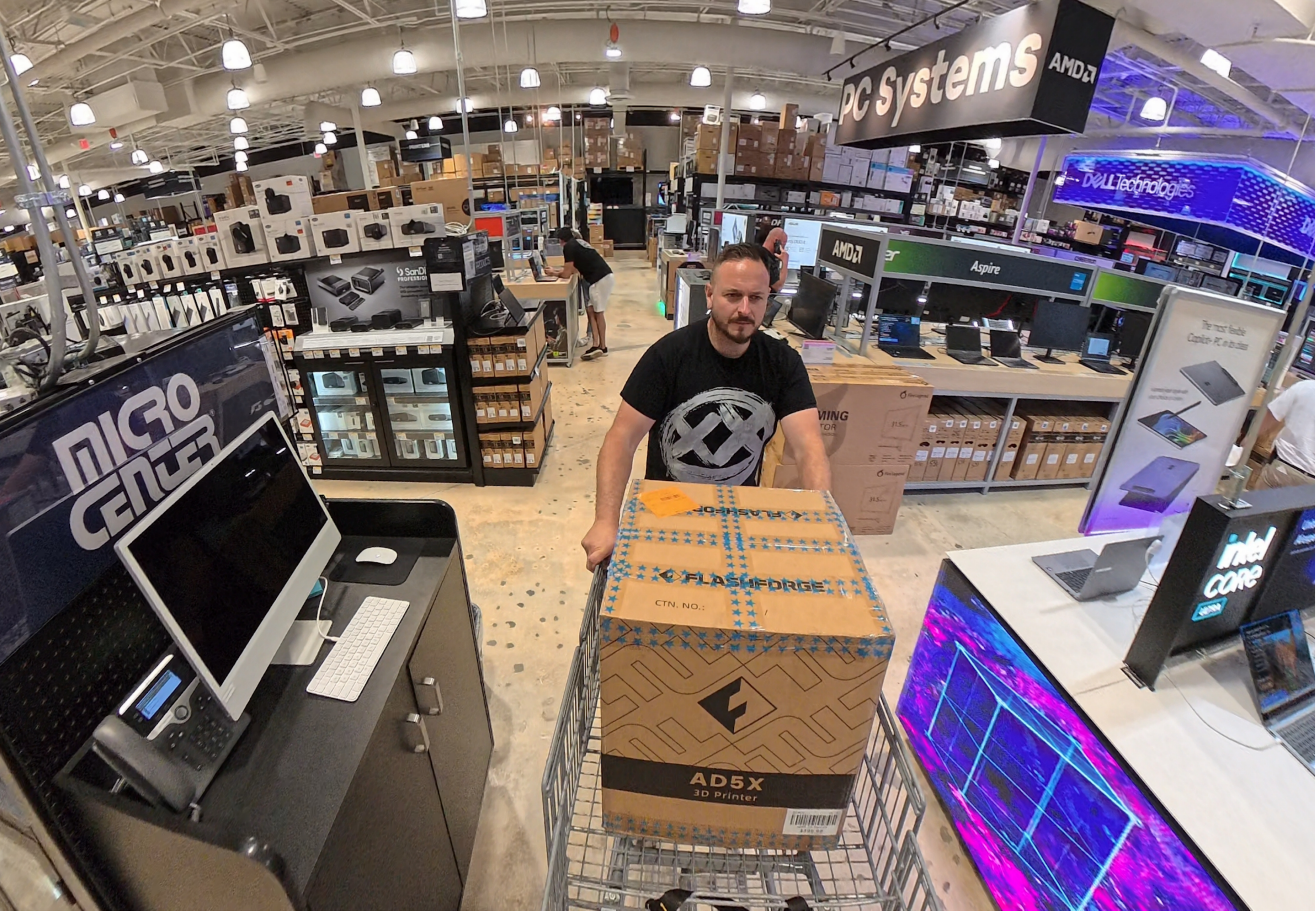 A man excitedly buying the Flashforge AD5X Multi-Color FDM 3D Printer at Micro Center