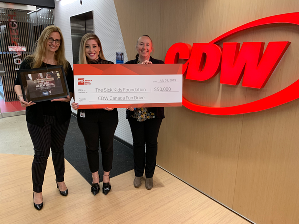 Left to right: CDW Canada’s Julie Clivio and Jackie Macera present Jennifer Frew of SickKids Foundation with this year’s donation.