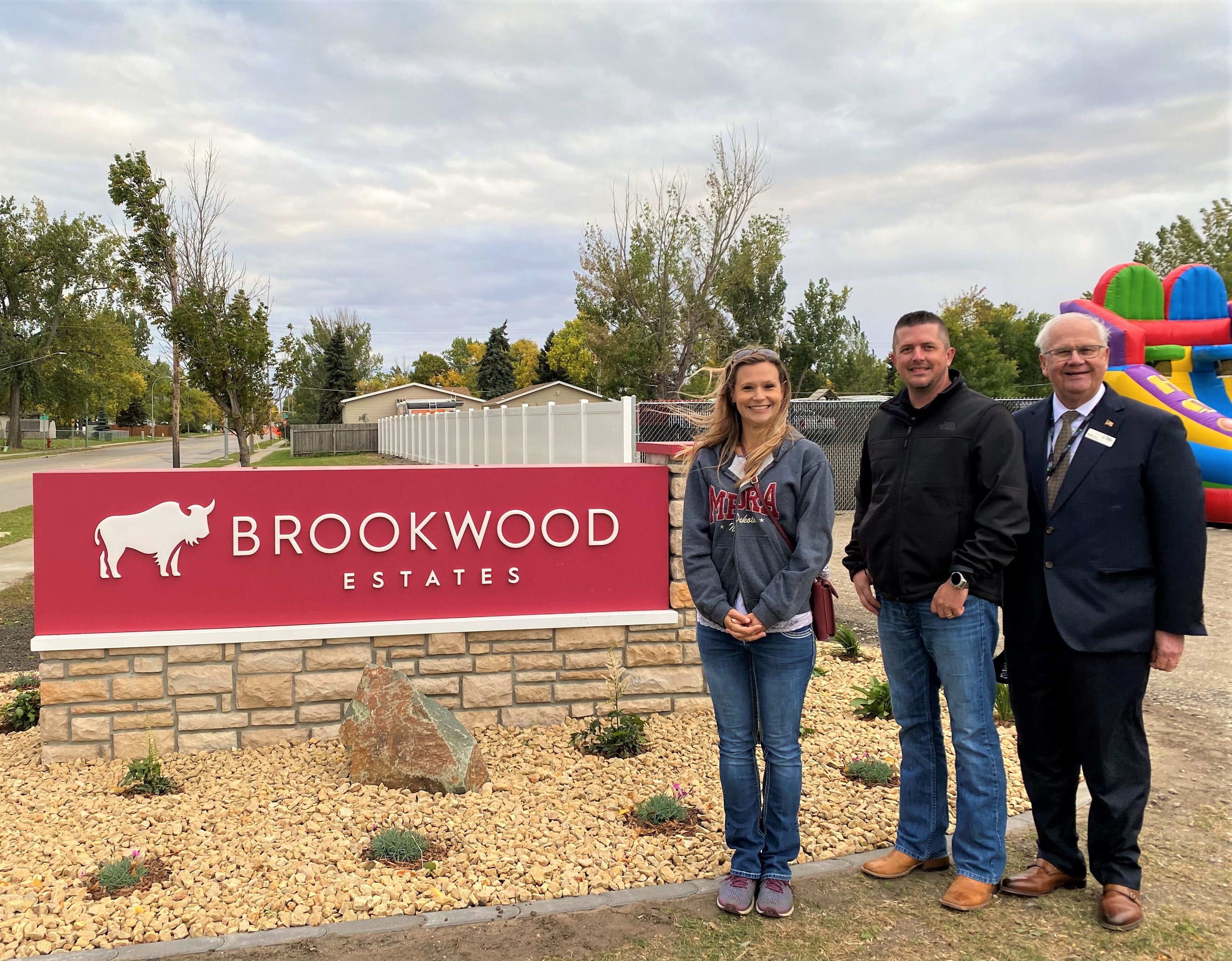West Fargo City commissioner, Mandy George; Havepark Communities Divisional Vice President, Sean King; and West Fargo City Mayor, Bernie Dardis pose in front of the newly installed Brookwood Estates monument sign.