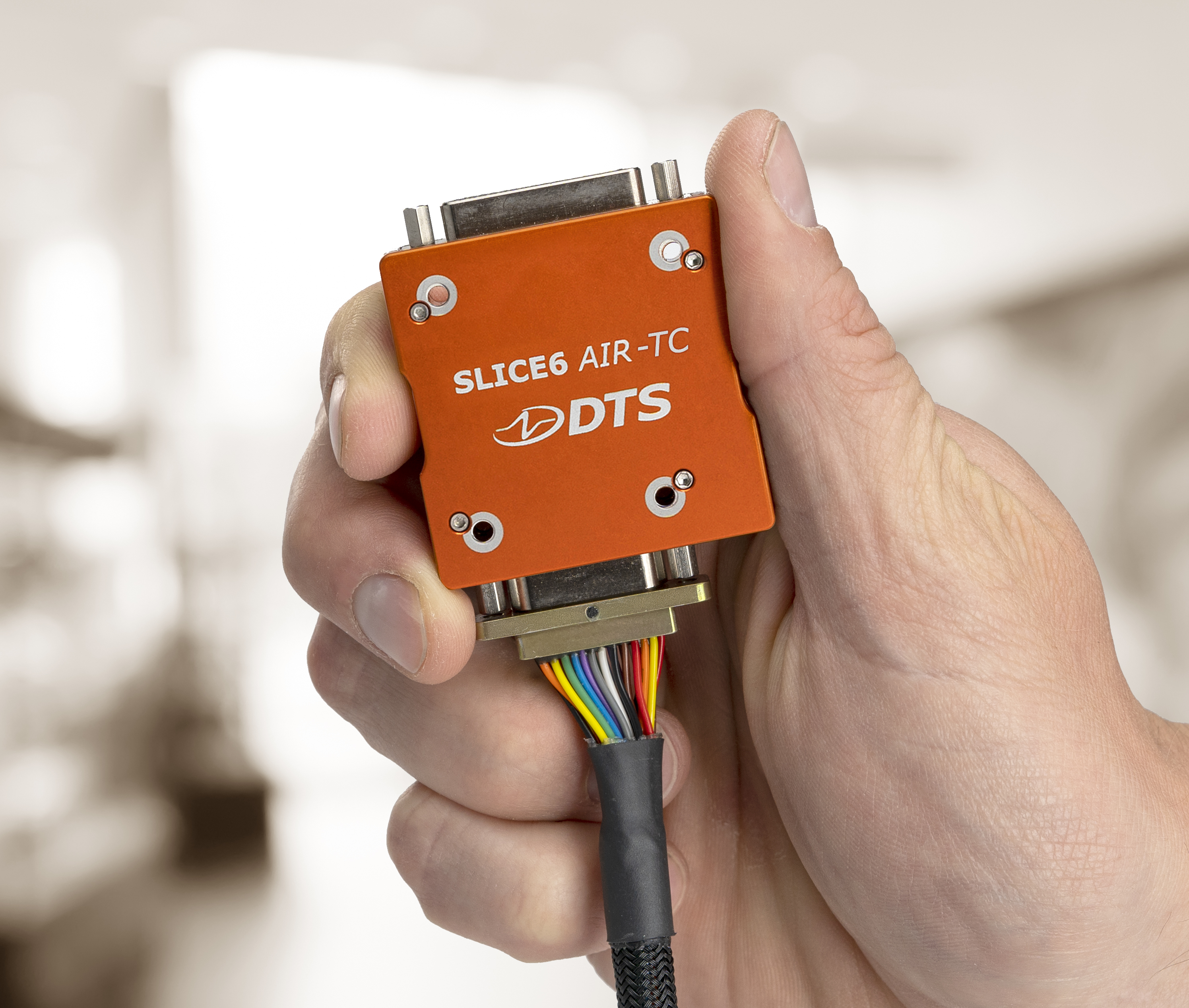 The SLICE6 AIR-TC, a miniature 24-channel data acquisition system with real-time streaming.