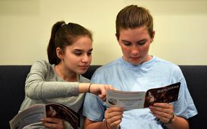 Two Teens reading MJ booklet(2)