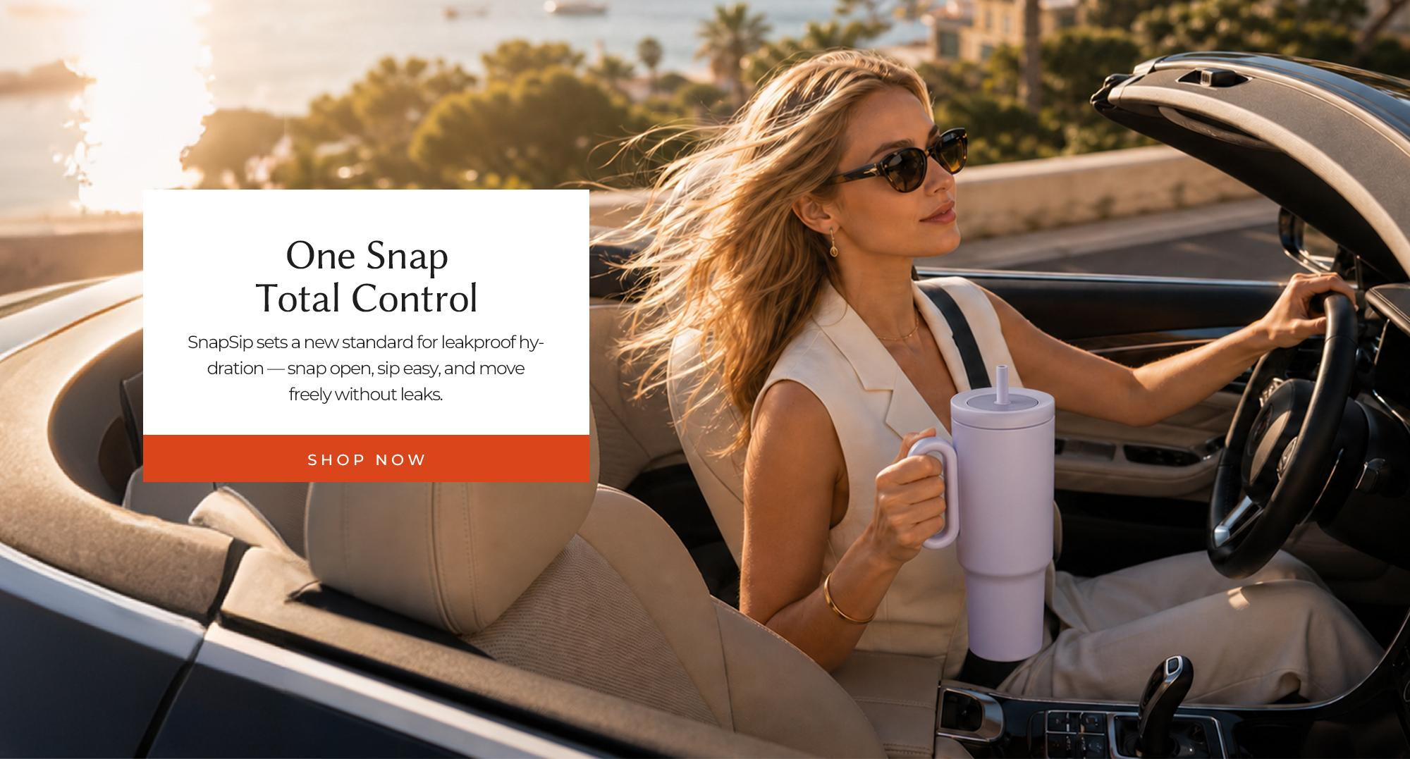 SnapSip Travel Mug in a convertible car with woman driving during a sunny coastal road trip