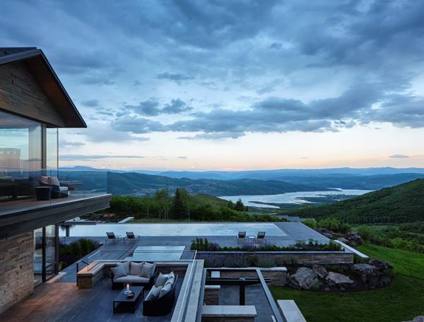Infinity pool at Park City home overlooking reservoir and ski area 