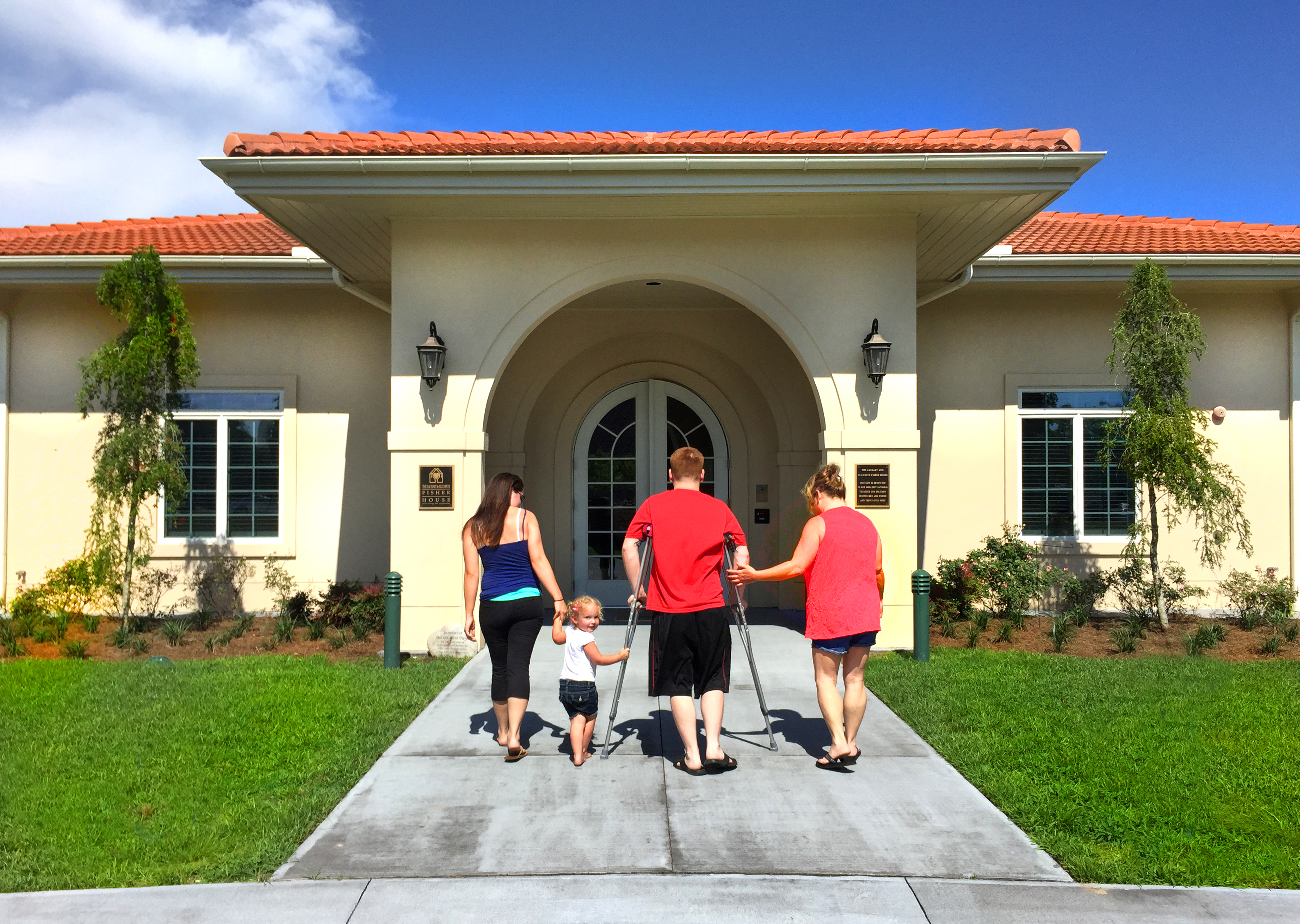 An Air Force service member takes a break from arduous rehabilitation to visit his family at Fisher House.