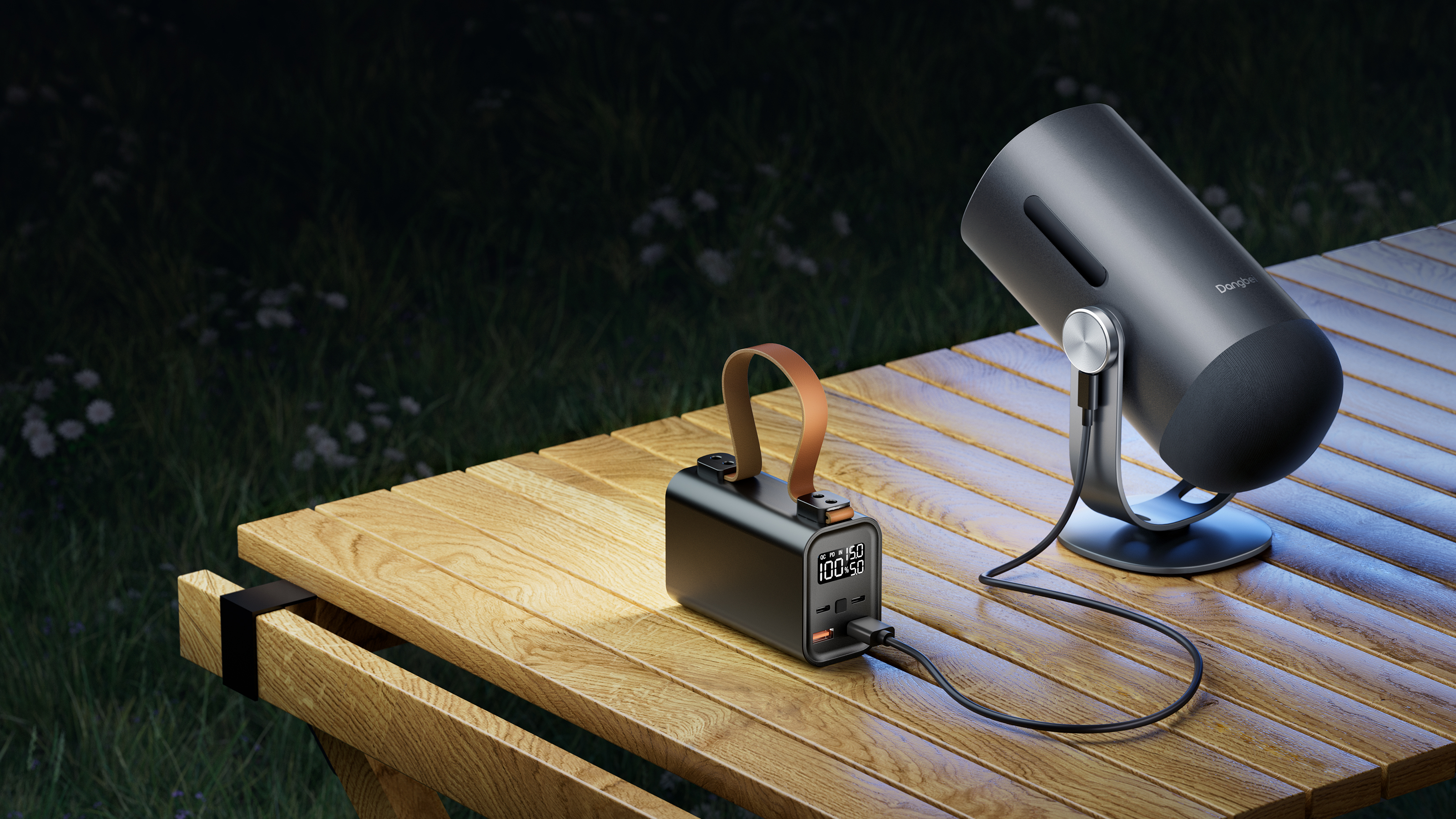 Dangbei Freedo portable projector on a wooden garden table at night, powered by a battery pack, set up for outdoor viewing - Amazon Prime Day 2026.