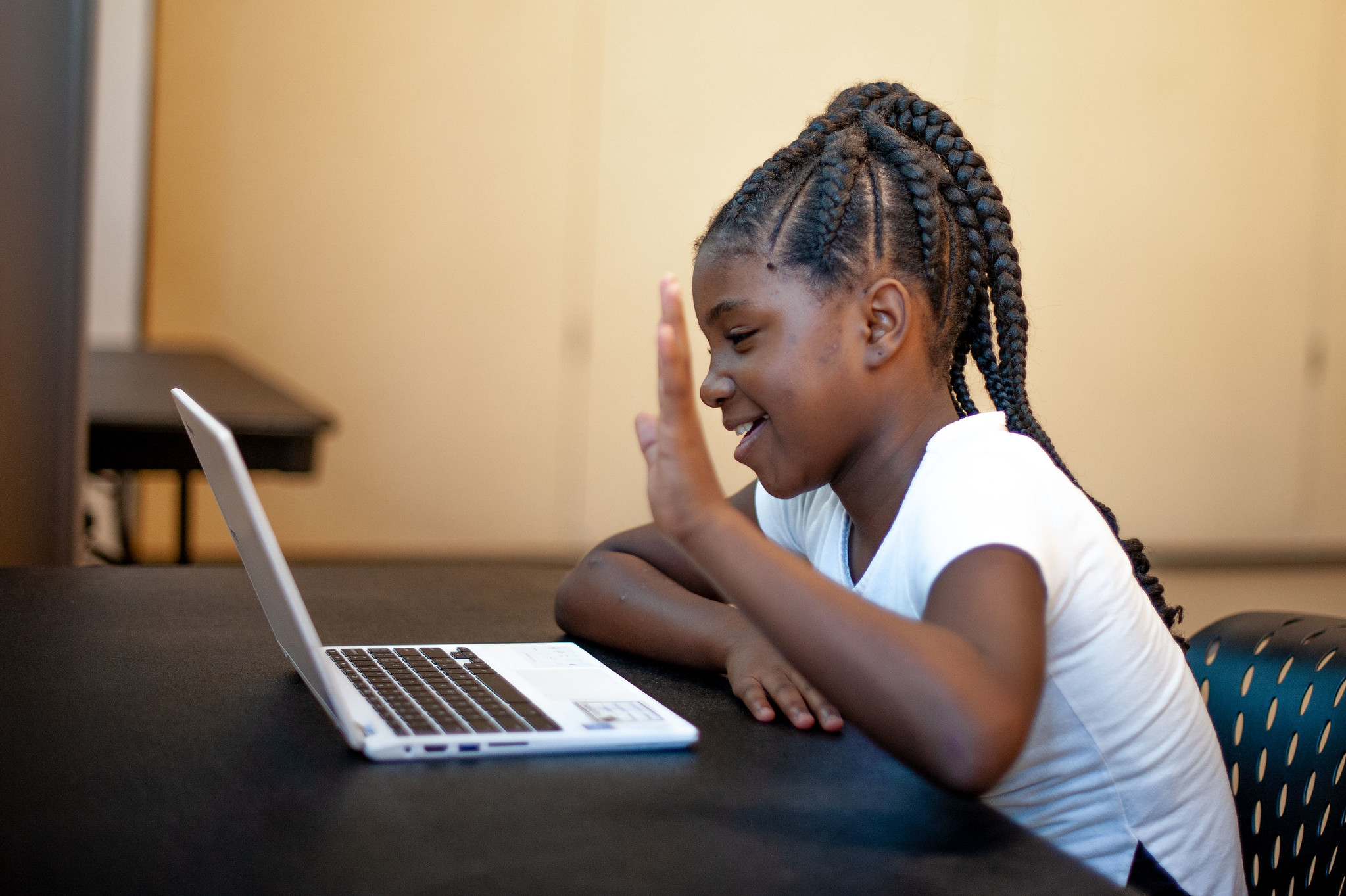 A Reading Partners student works remotely with a volunteer tutor using the Reading Partners Connects program innovation (photo credit: Reading Partners)