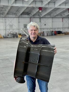 Figure 1. Jetoptera's CTO, Dr. Andrei Evulet holding a 250 lbf class carbon fiber thruster that weighs less than 10 lb