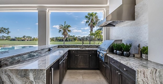 Photo of a kitchen overlooking a backyard