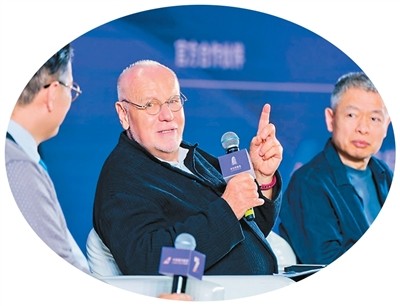 Italian filmmaker Marco Müller (center) interacts with the audience at a masterclass during the festival.