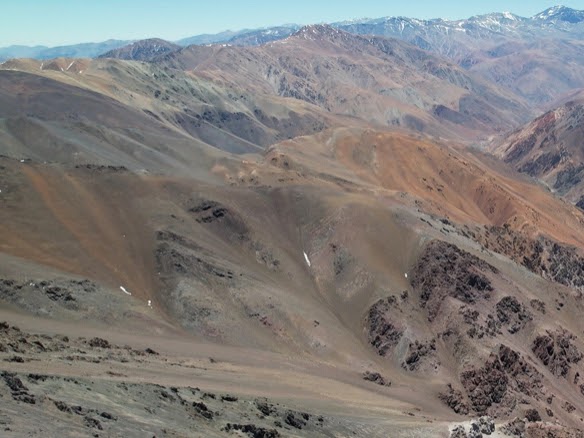 Image 4: Recent aerial photo of a portion of altered talus material where sampling/mapping is underway