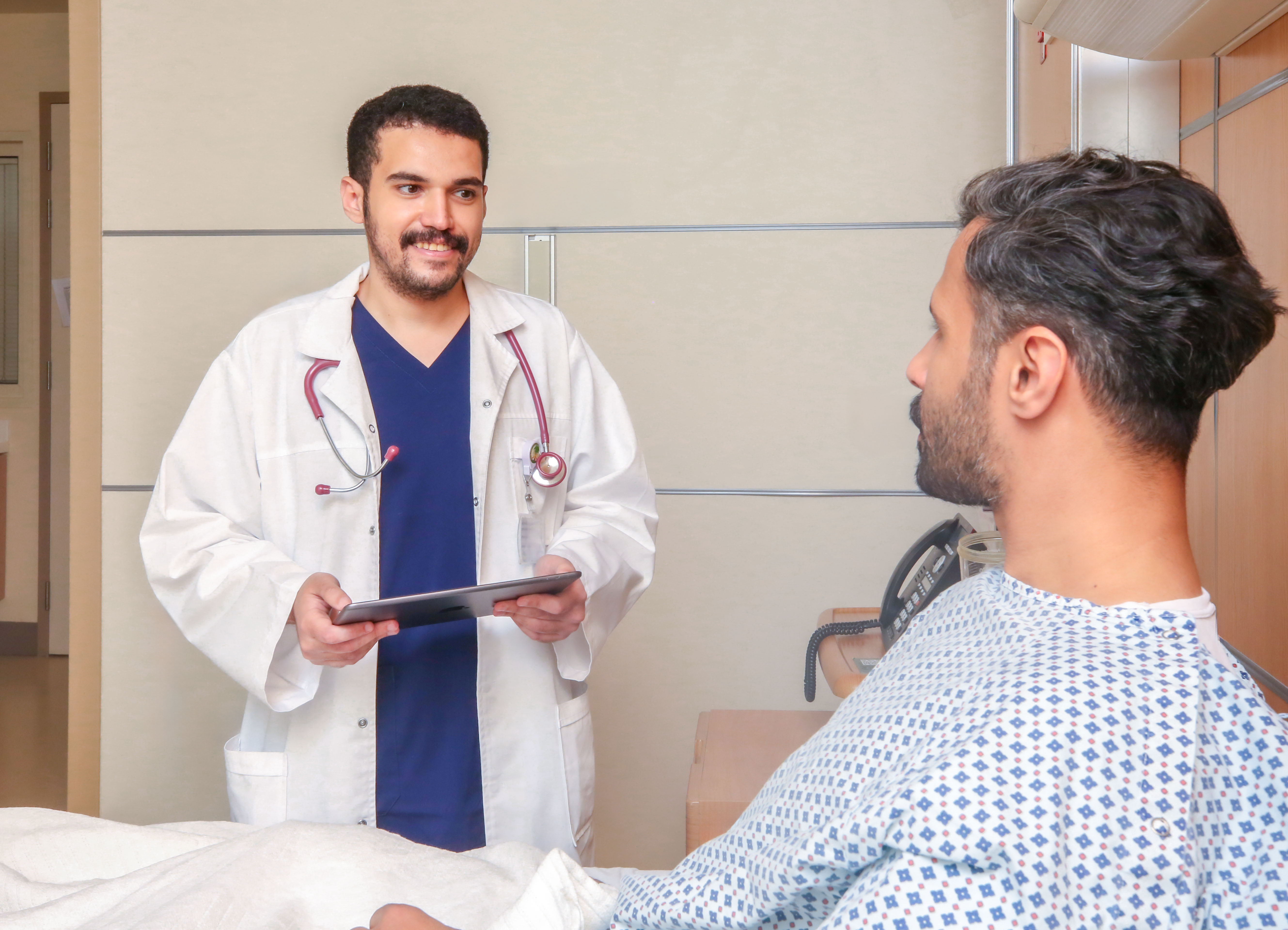 Illustrative image of patient care within KFSHRC's clinical research environment.