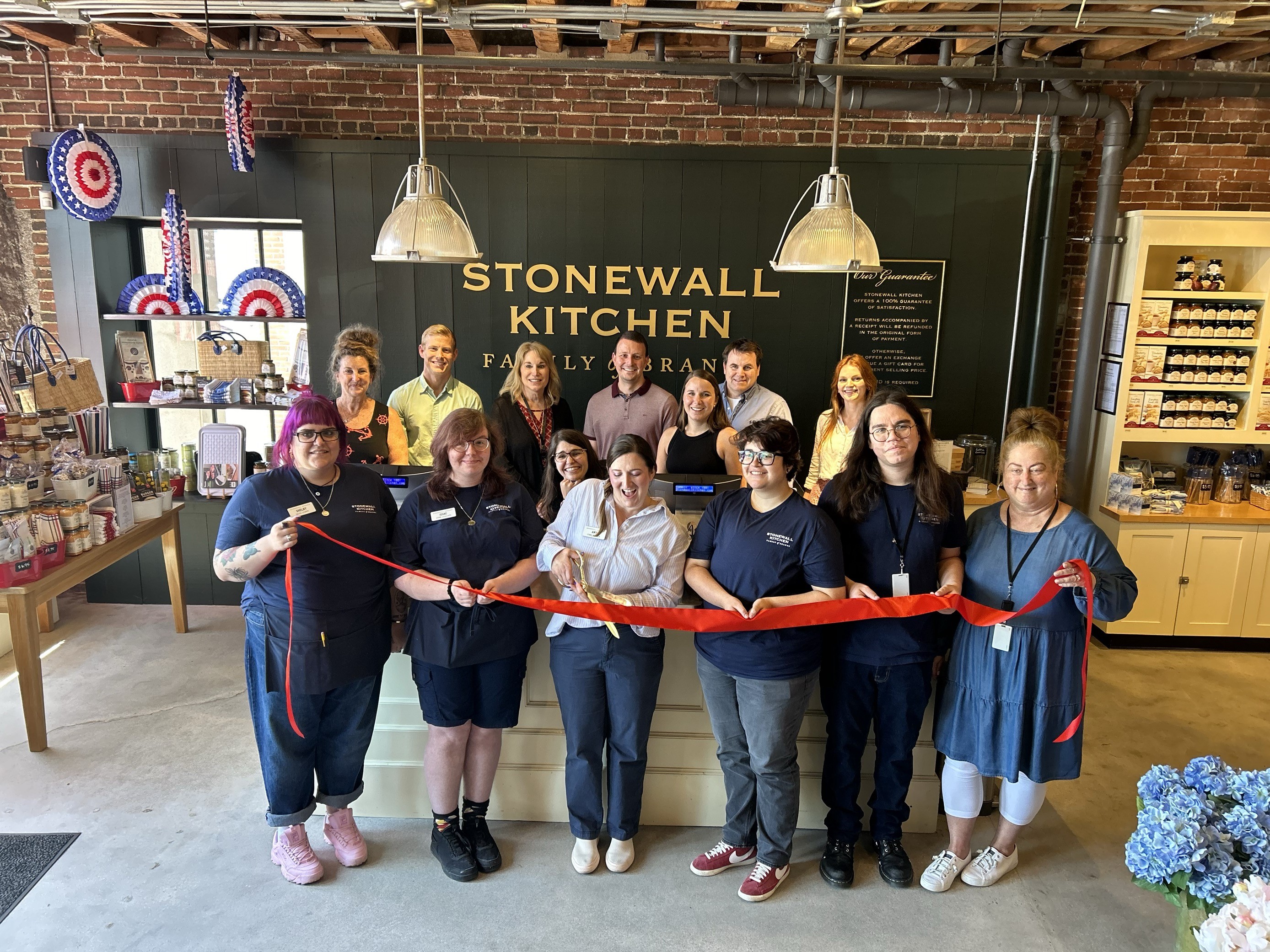 Stonewall Kitchen officially cut the ribbon on its new company store location in Portland, Maine. Cutting the ribbon was Portland Company Store Manager, Amy Denuzzio (middle) alongside members of the Portland retail team and company headquarters in York.