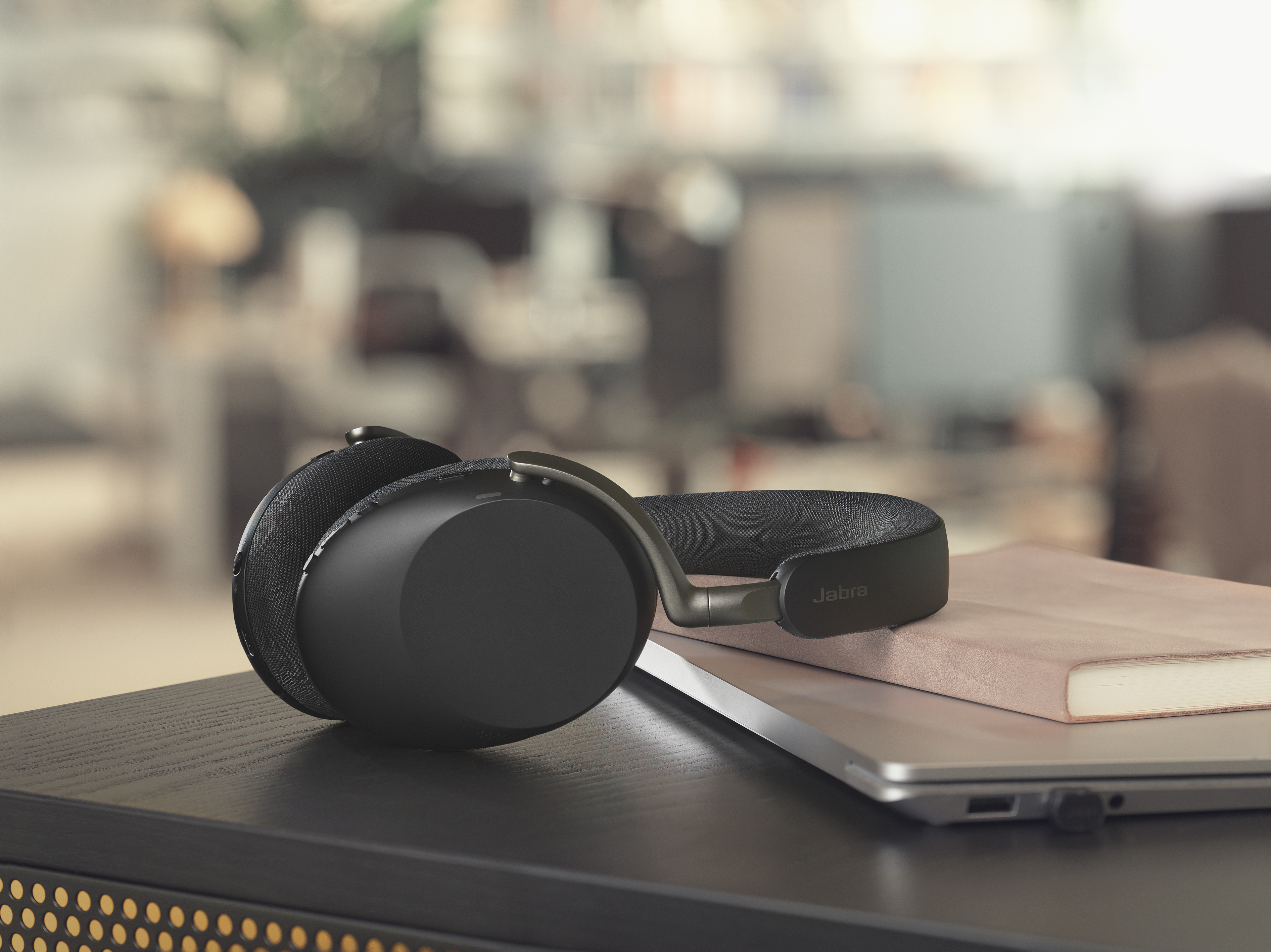 Jabra Evolve3 85 over-ear headset laying on a desk