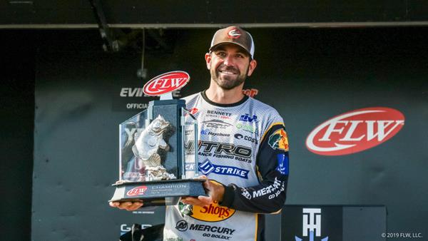 FLW Tour pro Casey Scanlon holds up his trophy after winning the FLW Tour on Lake Champlain presented by T-H Marine. (Kyle Wood)