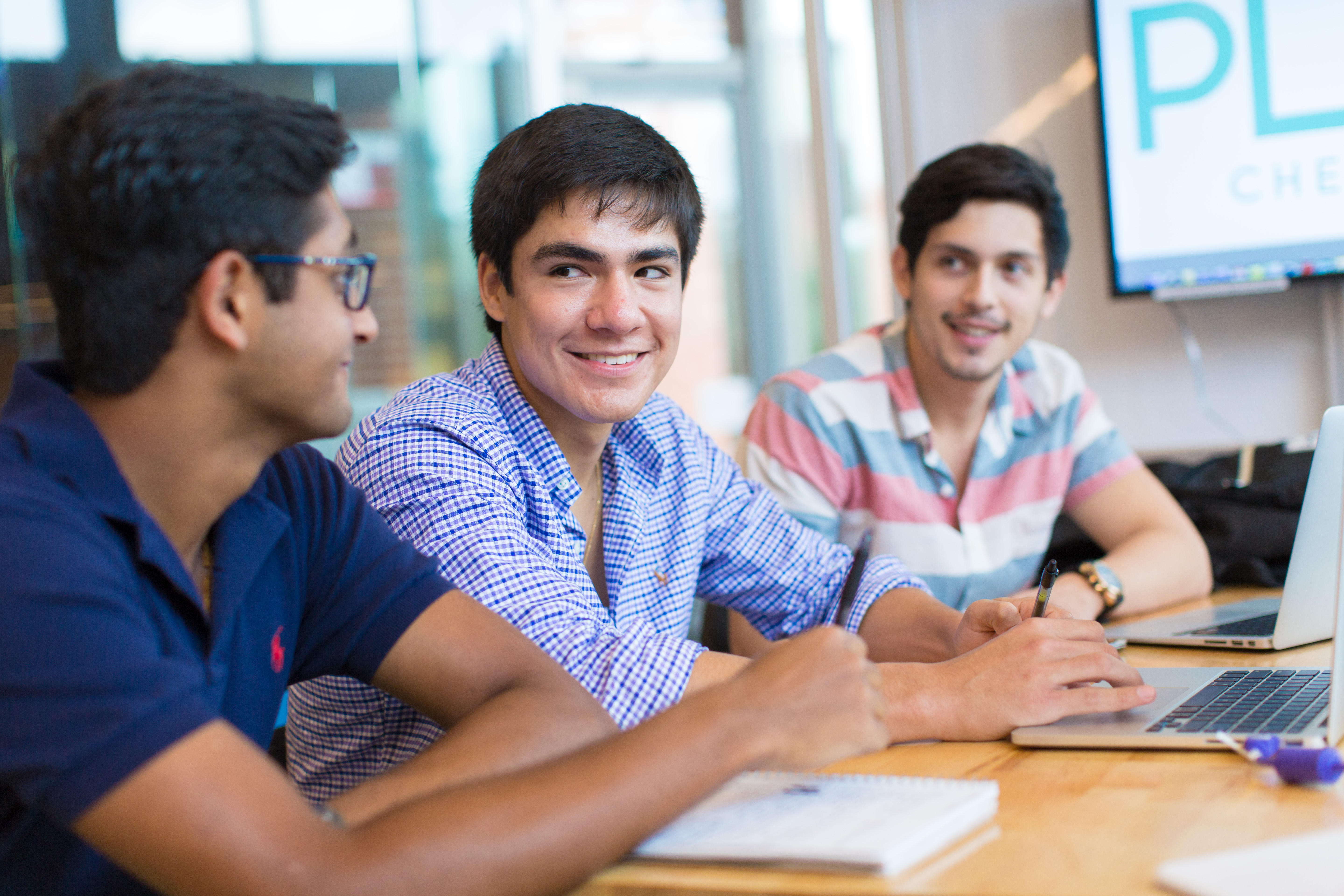 Entrepreneurship students at Trinity University in San Antonio, Texas, discuss their product and business model, 