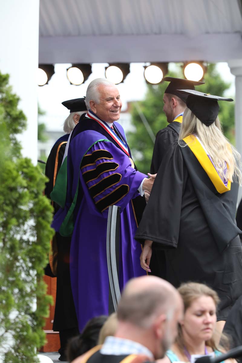 HPU President Nido Qubein and Dr. Michio Kaku shook the hand of every graduate. 