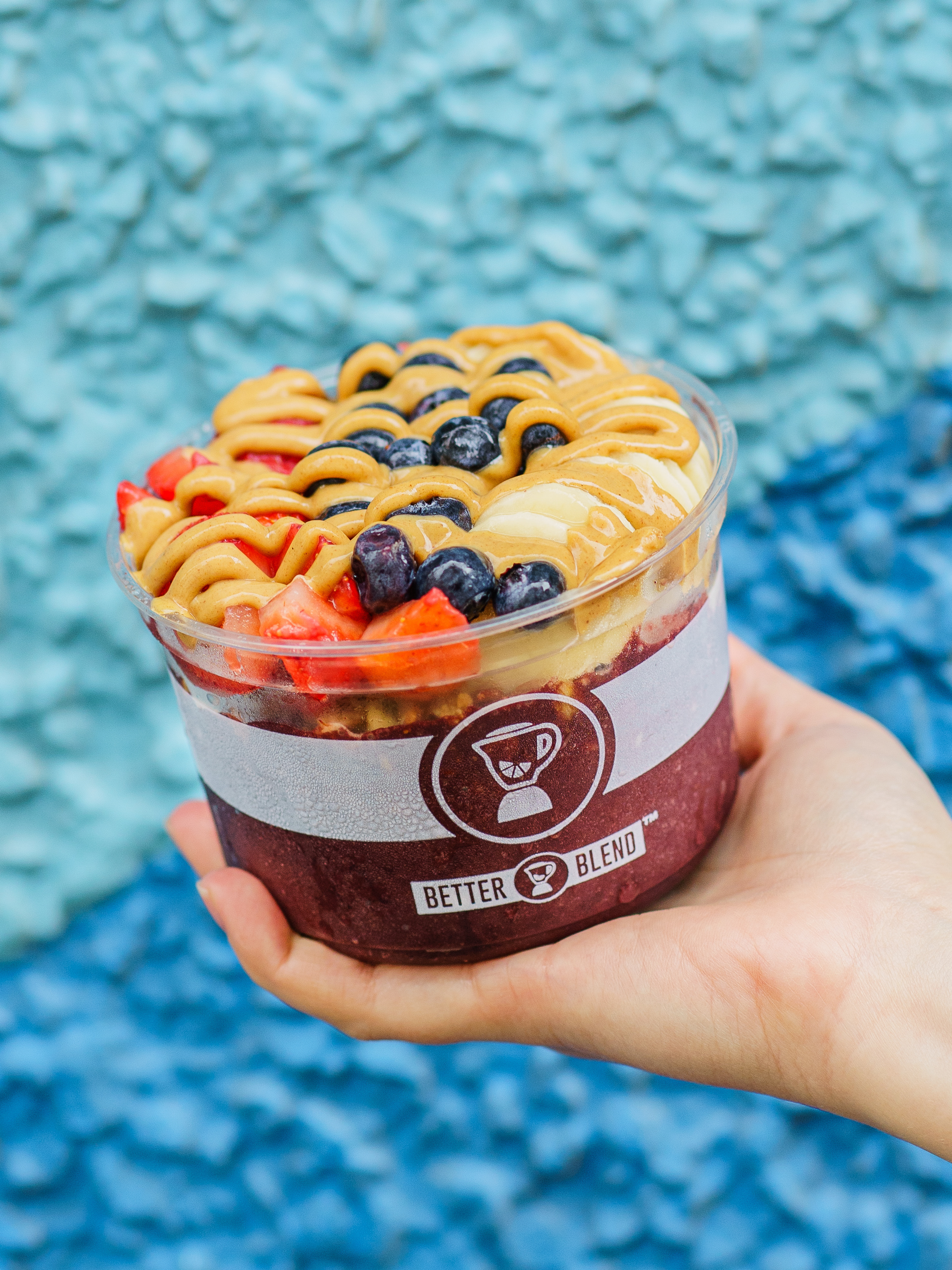 Protein-packed Better Blend Açaí Power Bowl topped with fresh fruit and peanut butter.