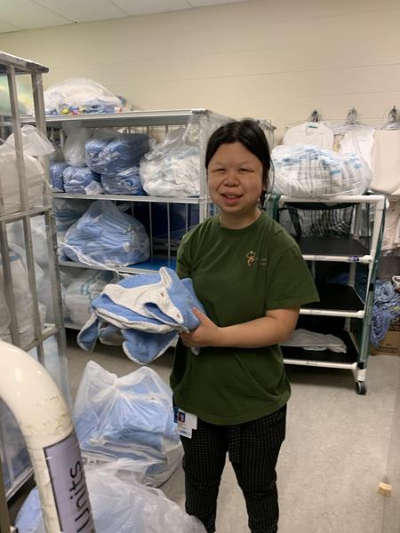 Congxiao working with Sodexo and helping with incoming linen deliveries through her Project SEARCH Toronto co-op placement at Holland Bloorview Kids Rehabilitation Hospital.