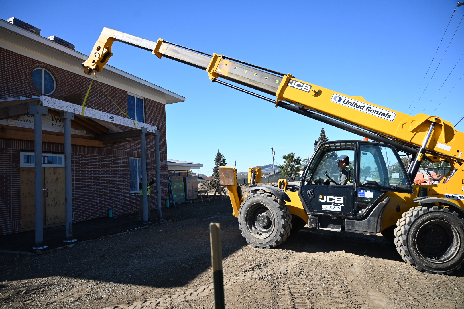 Fisher House at Captain James A. Lovell Federal Health Care Center receives final beam during a Topping Off Ceremony.