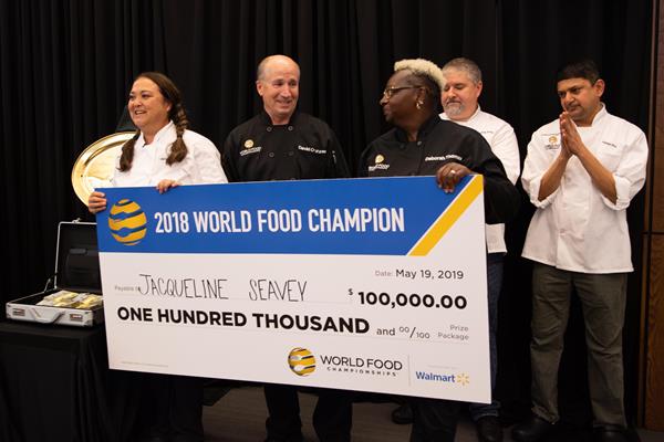 World Food Champion, Jacqueline Seavey, and her teammates: David Crabtree and Deborah Thomas holding the winning check.