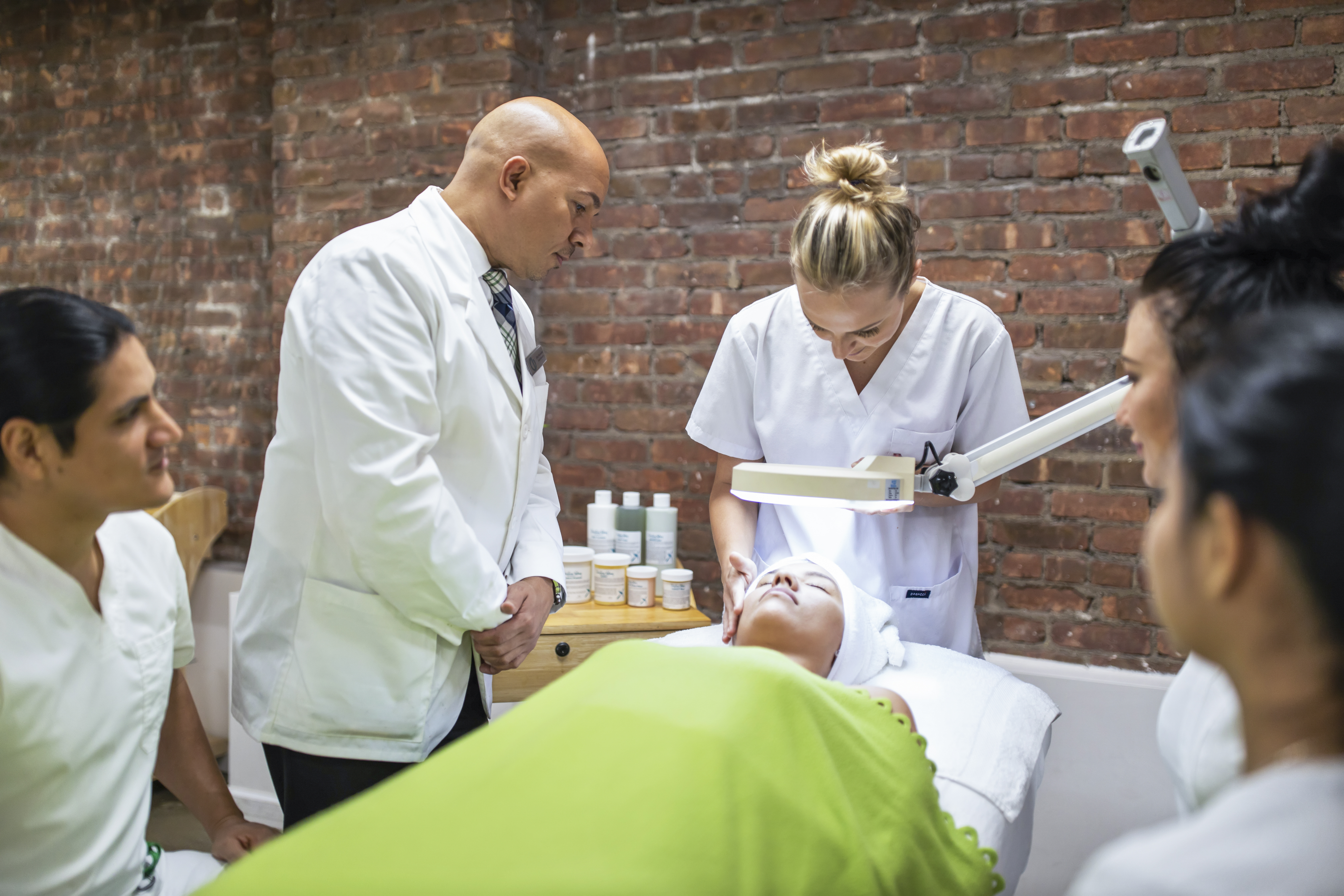 An instructor guides students through hands-on training at the Christine Valmy International School for Esthetics, Skin Care & Makeup, continuing the company’s 60-year tradition of pioneering esthetics education.