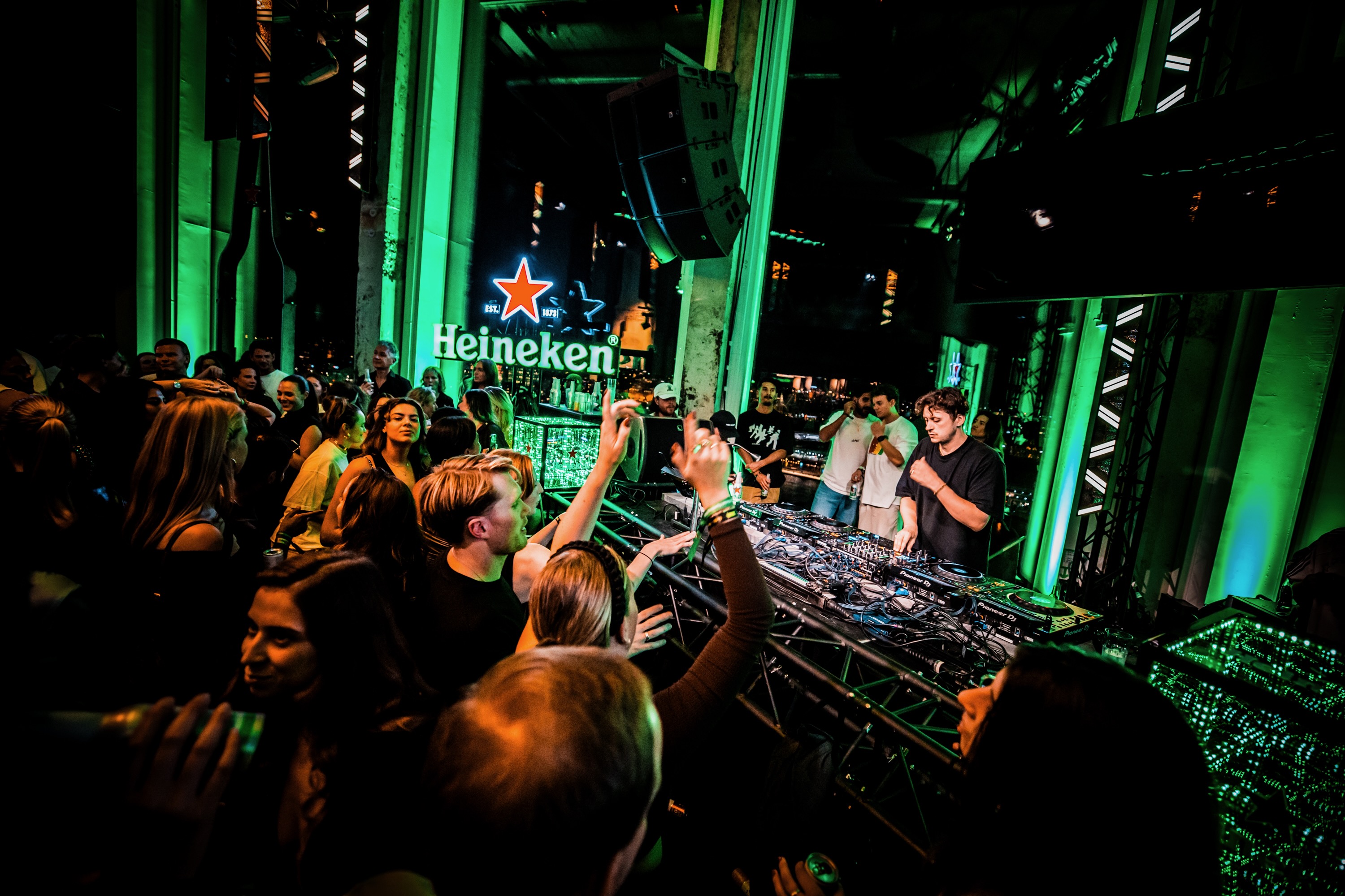 Heineken hides secret message, invisible to the naked eye but visible on phone screens, at Amsterdam Dance Event opening event with Barry Can't Swim to encourage people to be in the moment - not on their phone - when socialising.