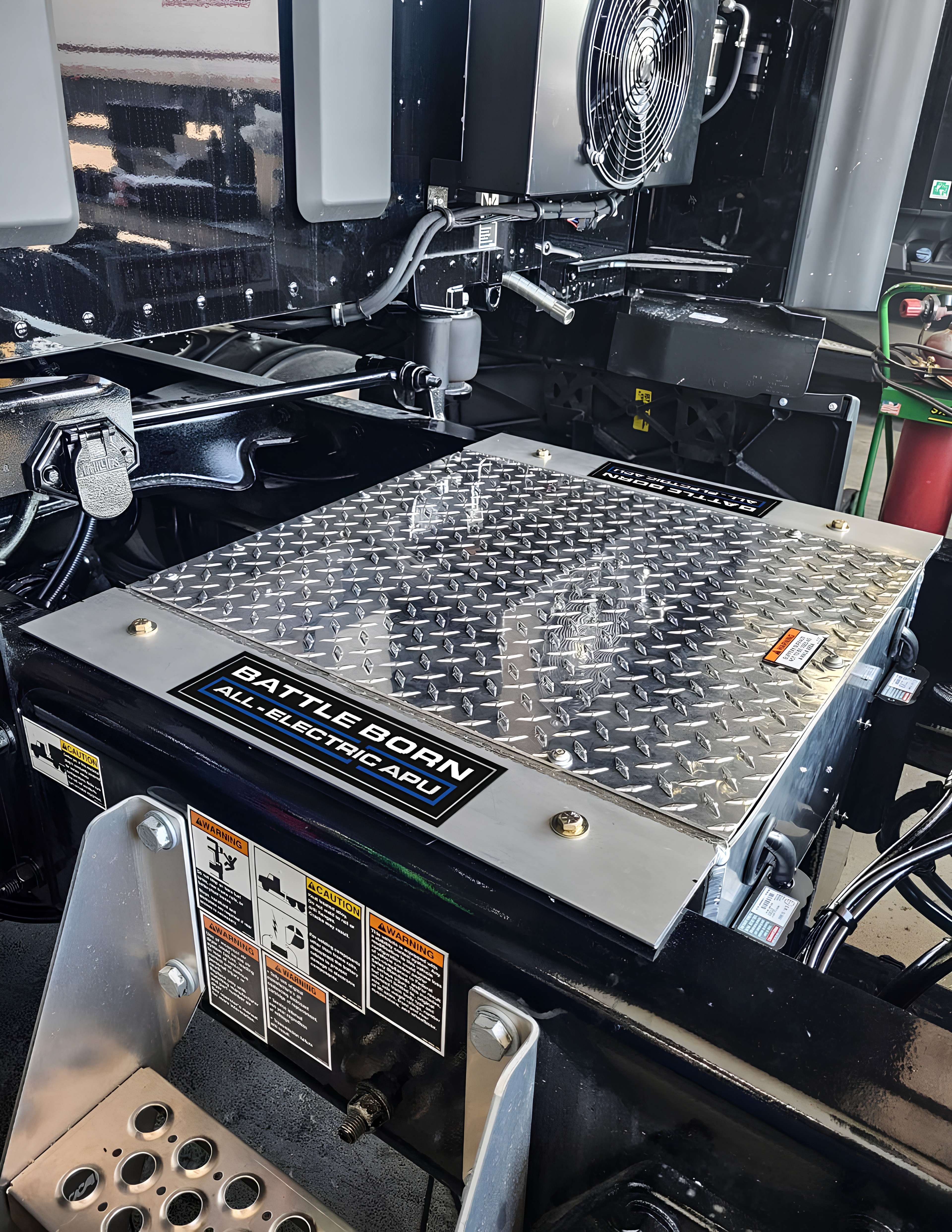 A Battle Born All-Electric APU installed in between the frame rails of a Stevens Transport truck - PR