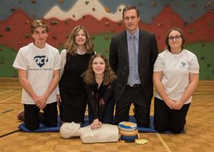 Amgen Canada’s Brian Heath, Vice President and General Manager and Julie Gauthier, Regional Director of Government Affairs learn CPR along with high school students as part of the ACT High School CPR and AED Program.