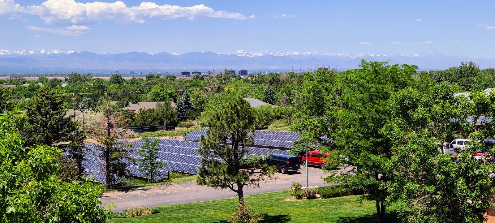 A view of the Oxford Vista solar field with a backdrop of the Colorado mountain range.