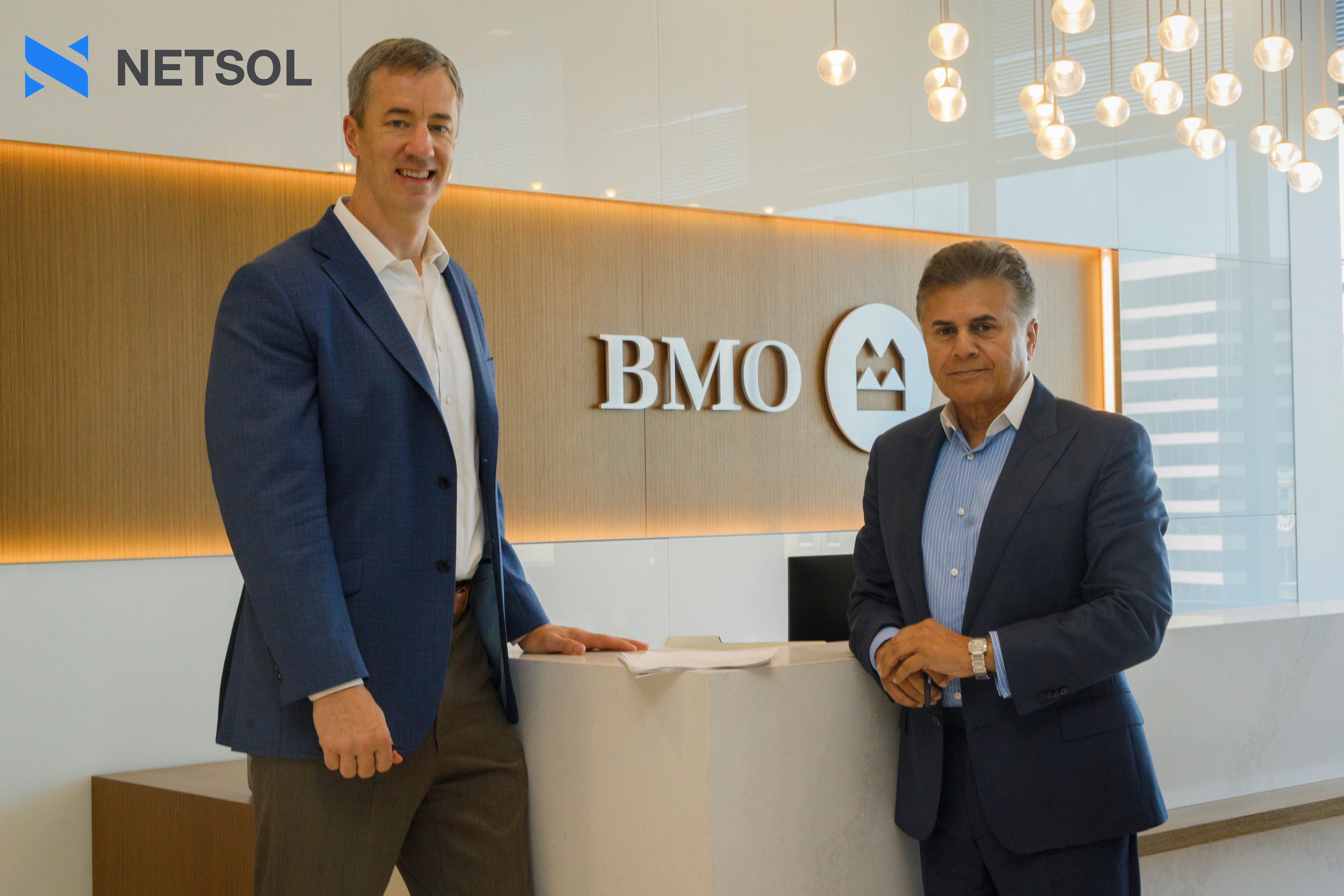 Tom Kritzer, Head, U.S. Equipment Finance at BMO (left), and Najeeb Ghauri, Founder and Chief Executive Officer of NETSOL Technologies (right), at BMO's offices following the agreement signing.