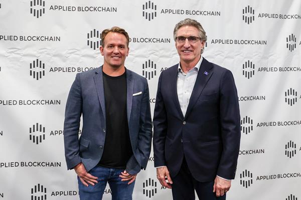 CEO of Applied Blockchain, Wes Cummins, with North Dakota Governor, Doug Burgum