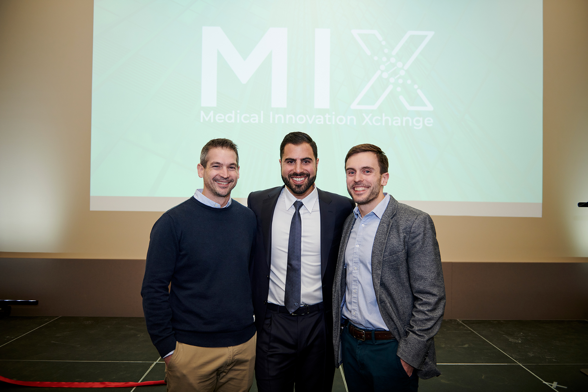 (From left to right) Intellijoint Surgical co-founders: Richard Fanson, Chief Science Officer; Armen Bakirtzian, Chief Executive Officer; and Andre Hladio, Chief Technology Officer participate in the Medical Innovation Xchange (MIX) Grand Opening Ribbon-Cutting and medical technology leadership networking event, Kitchener, Ontario, Friday, January 10, 2020.  PHOTO/Intellijoint Surgical Inc.