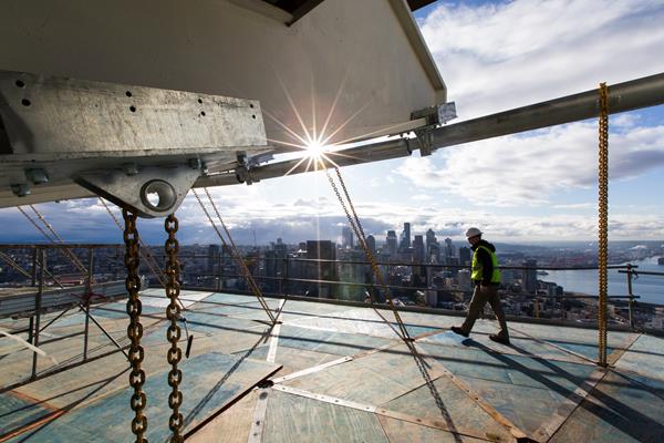The BrandSafway access solution included a 106-foot-diameter starter platform using the QuikDeck® Suspended Access System, which was then hoisted into place at 500 feet with 12 two-part Tractel hoists, each with an 8,800-pound capacity. Once secured, the platform was then built out to its full size of 135 feet in diameter at a weight of 174,000 pounds. BrandSafway then erected an all-season weather barrier, which could withstand a 115 mph wind load. 