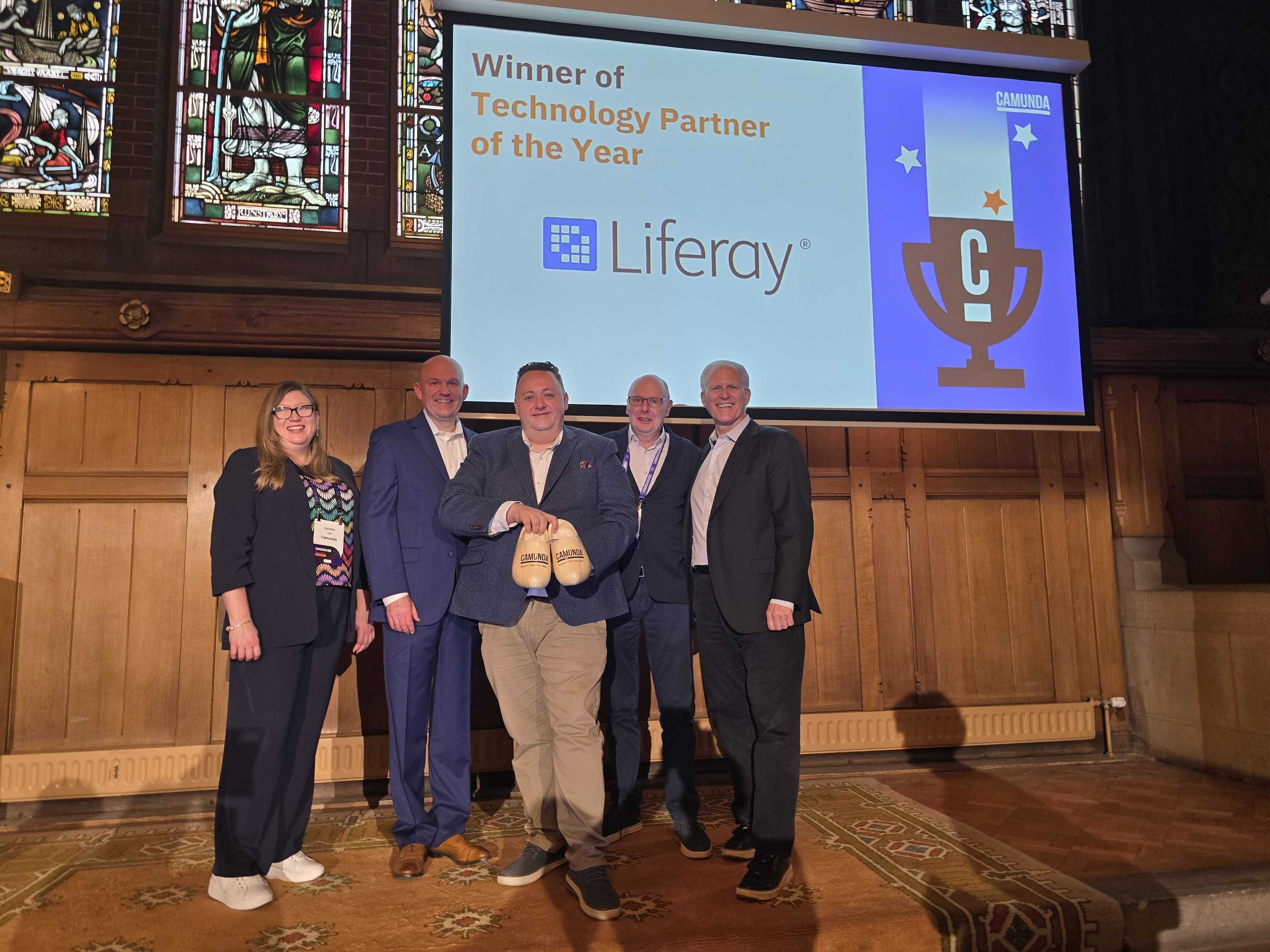 Liferay team members accept Camunda’s 2026 Technology Partner of the Year award during the Camunda Partner Summit at CamundaCon 2026 in Amsterdam.