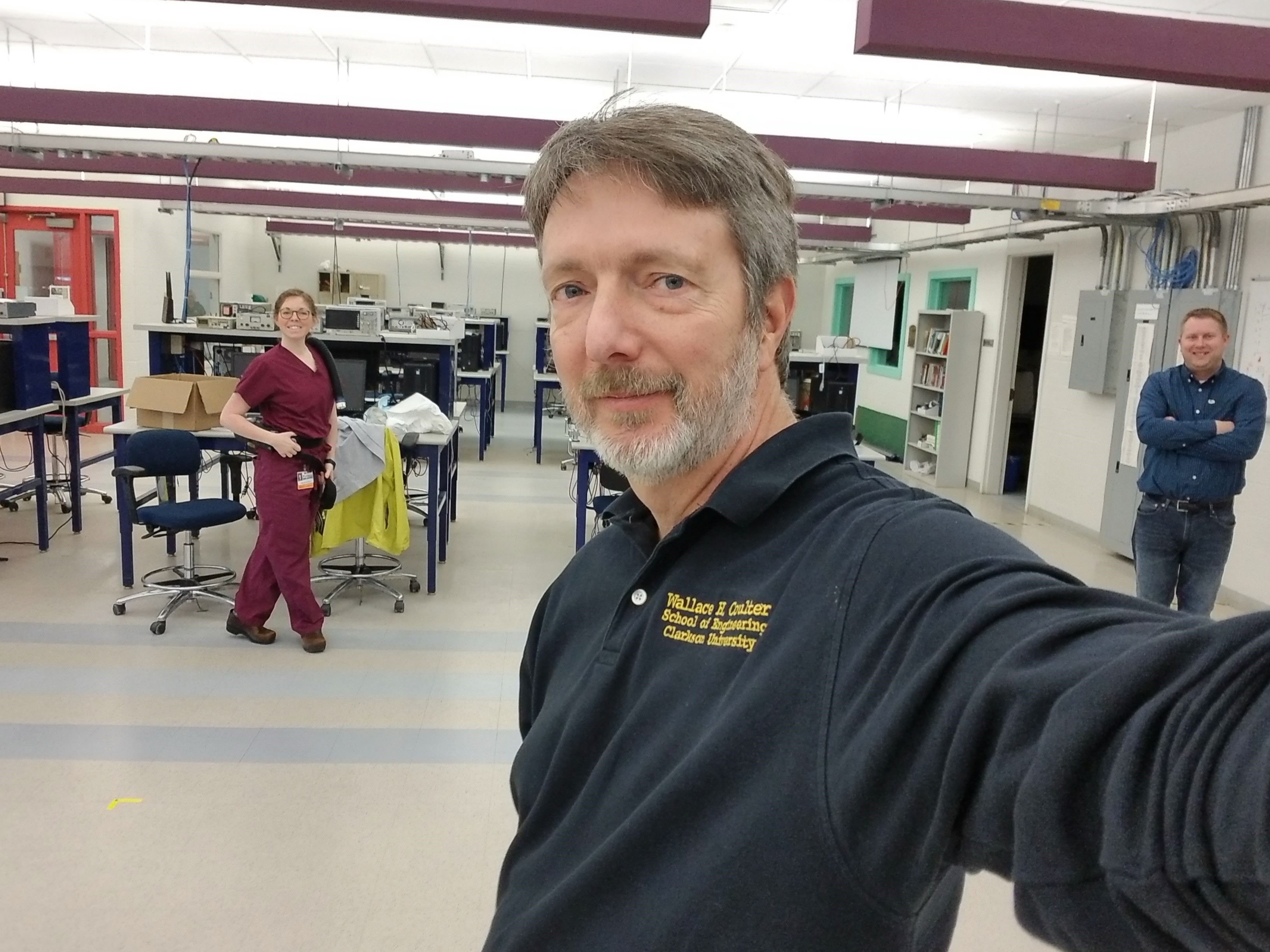 Left to right: Kylie Broughal, Professor Bill Jemison, and Jacob Weller, engineering shop supervisor at Clarkson demonstrate the PAPR modification while socially distancing.