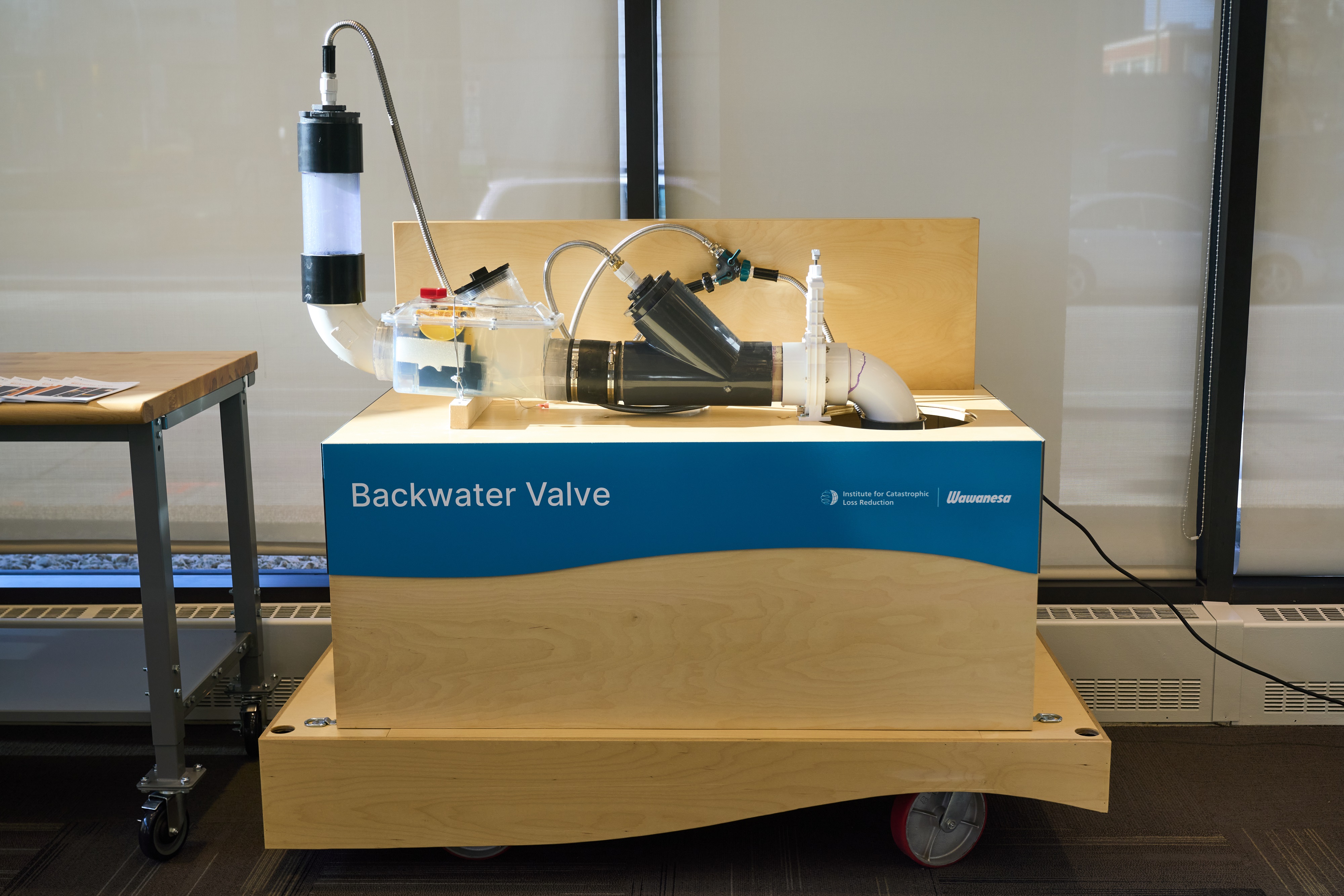 Among the many interactive displays in the Institute for Catastrophic Loss Reduction's Climate Resilience Centre is one showing how a backwater valve works to protect properties.