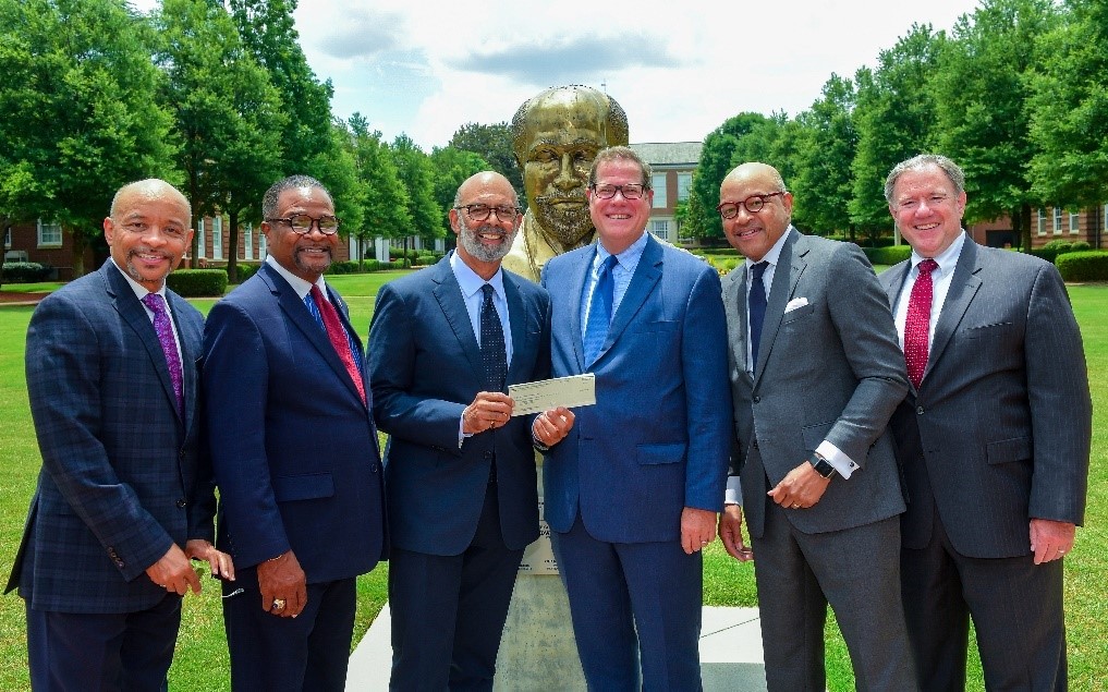 UNCF and NMSC officers gather with HBCU presidents at the Clark Atlanta University Dubois Statue Platform for the presentation of an additional $2.1 million grant from NMSC for the Achievement Capstone Program. In attendance (from left to right) are UNCF Executive Vice President and Chief Development Officer Mr. Maurice E. Jenkins, Jr.; Clark Atlanta University President Dr. George T. French, Jr.; UNCF President and CEO Dr. Michael L. Lomax; NMSC President and CEO Mr. Timothy E. McGuire; Morehouse College President Dr. David A. Thomas; and NMSC Executive Vice President Mr. Jeffrey Z. Little