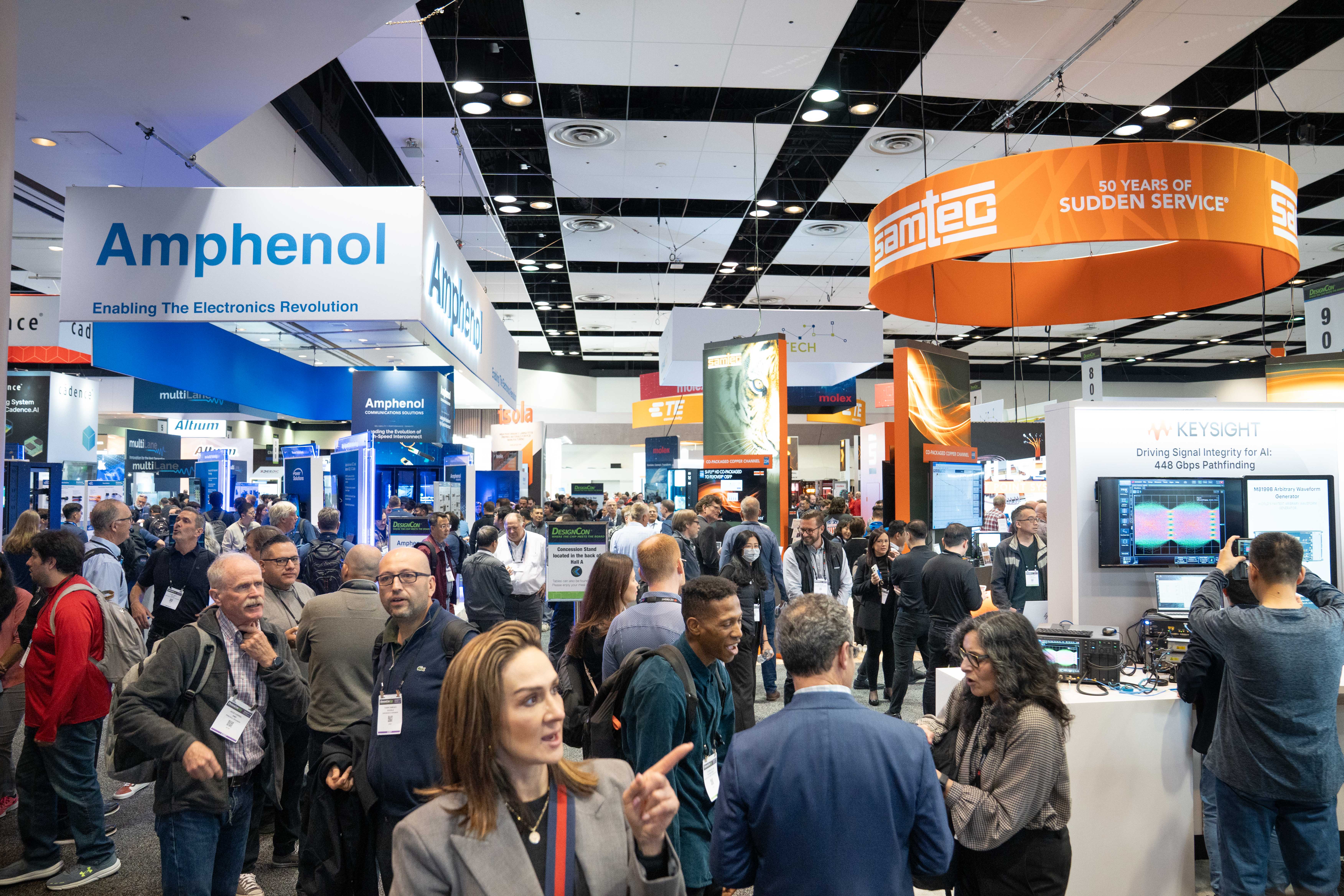 Show floor at DesignCon 2026, around the booth for Amphemol and Samtech. 